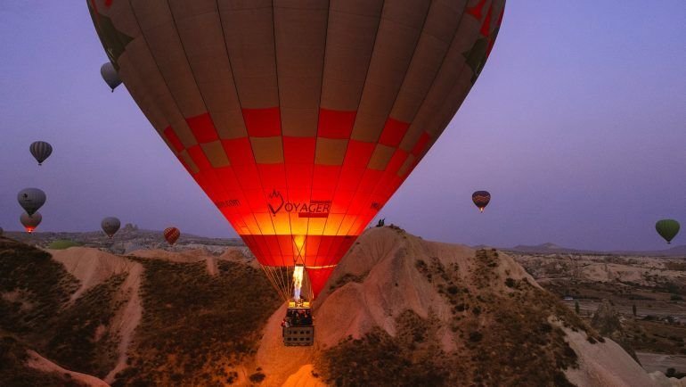 hot air balloon under grey sky