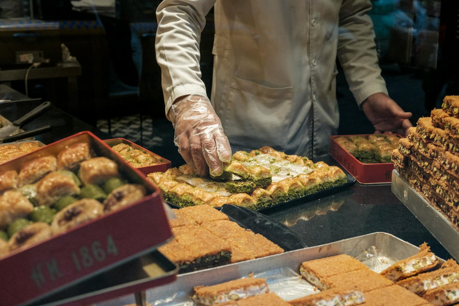 crop seller serving turkish sweets in box