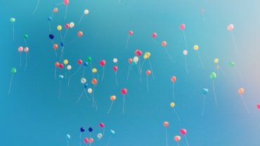 assorted colored balloons mid airs