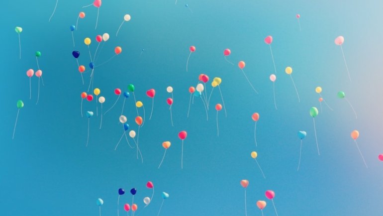 assorted colored balloons mid airs