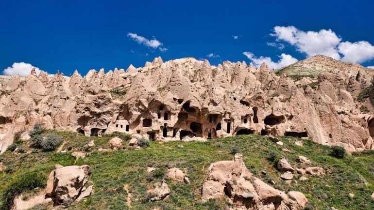 a mountain with a bunch of rock formations on top of it