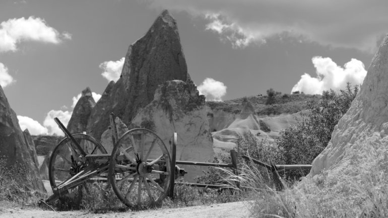 a black and white photo of an old wagon