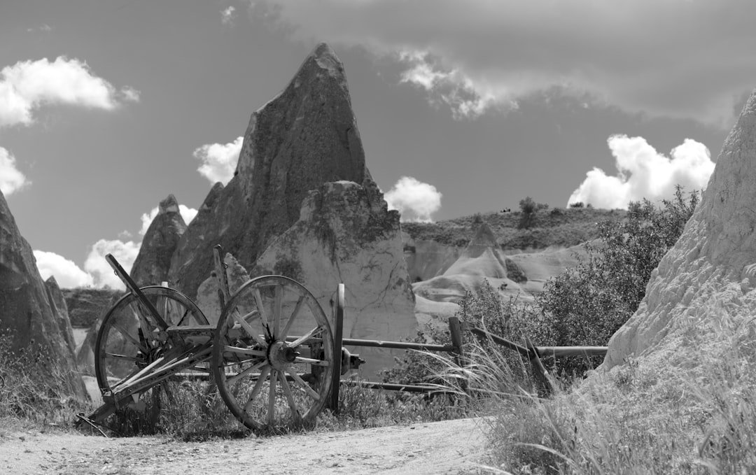 a black and white photo of an old wagon