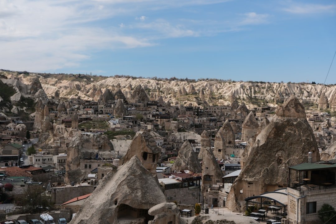 a view of a city in the middle of a mountain range