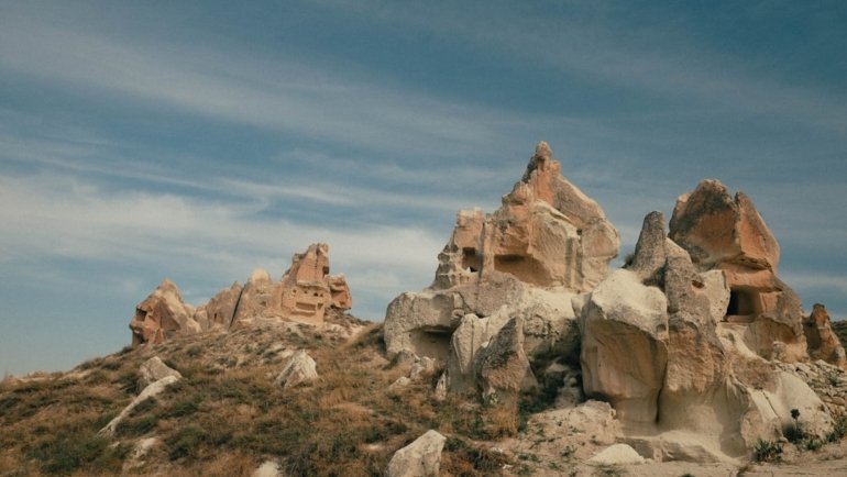 a group of rocks sitting on top of a hill