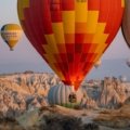 a group of hot air balloons flying in the sky