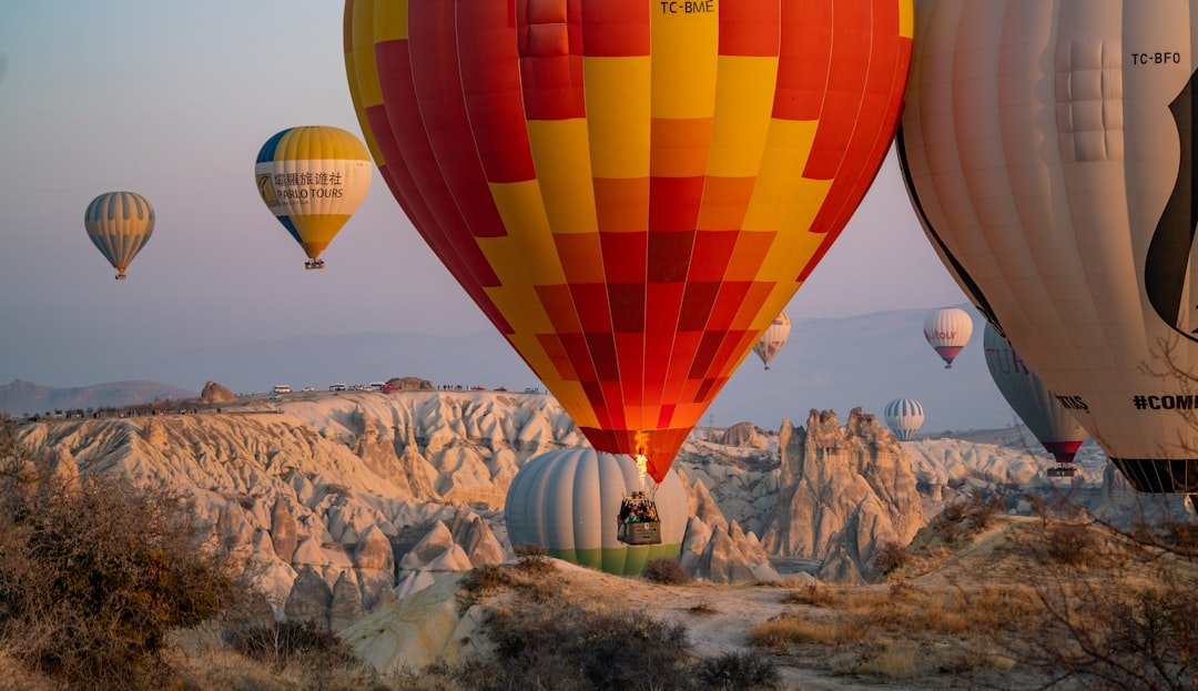 a group of hot air balloons flying in the sky