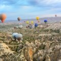 photo of assorted-color air balloon lot in mid air during daytime