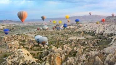 photo of assorted-color air balloon lot in mid air during daytime