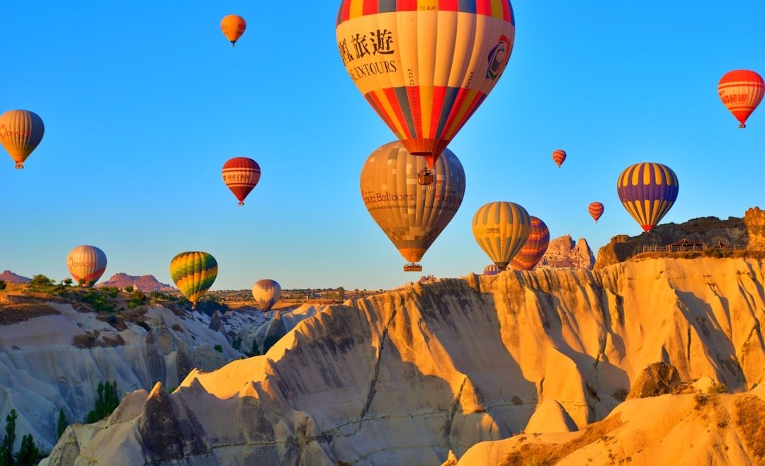 a group of hot air balloons flying in the sky