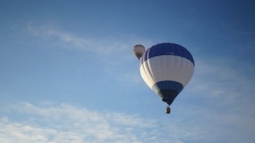 a group of hot air balloons in the sky