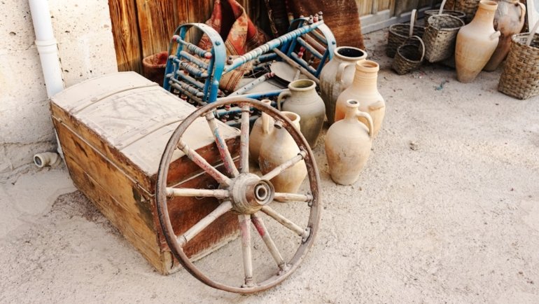 a cart with vases and pots