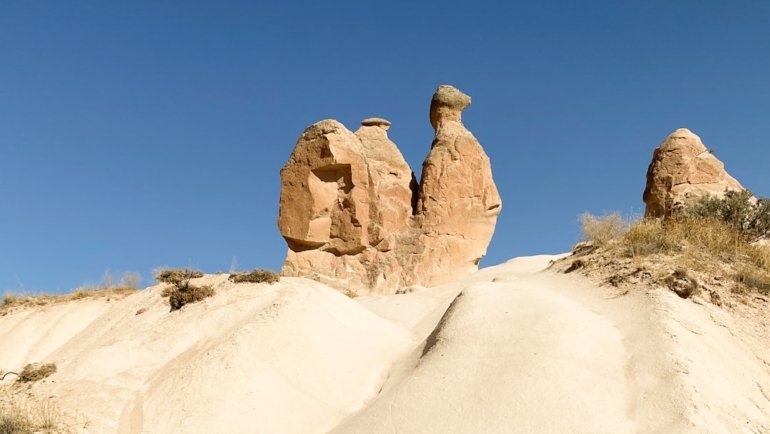 a group of large rocks in a desert