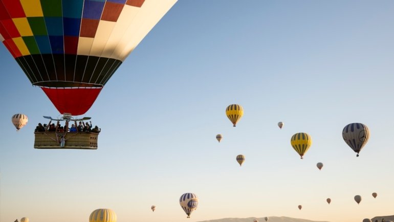 hot air balloons flying during daytime